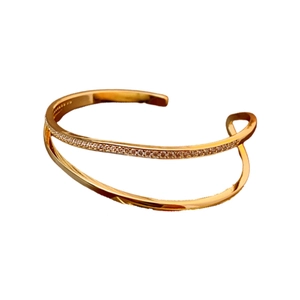 Minimalist double-layer gold plated open bangle with pavé zircons in a modern design