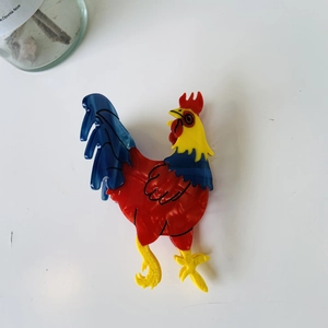 Colorful rooster cellulose acetate hair claw clip with vibrant red and yellow design