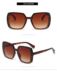 Detail view of leopard print square sunglasses with gradient lenses and gold rivets
