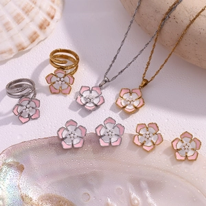 Detailed set of 18K gold plated cherry blossom jewelry with pink enamel and pearls