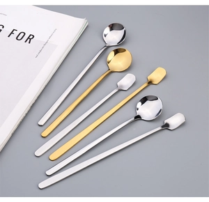 Detail view of long handle stainless steel mixing spoons in gold and silver finishes