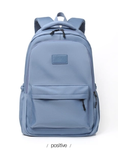 Detail of water-resistant foggy blue nylon school backpack with wide shoulder straps