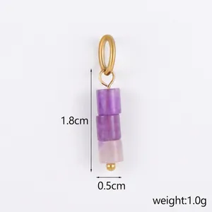 Detail of a natural purple stone bead pendant with dimensions 1.8cm by 0.5cm and gold ring