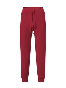 Detail of red waffle knit fabric texture on men's casual drawstring jogger pants