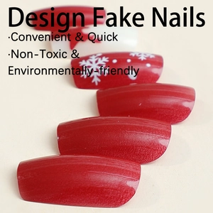 Christmas red press-on nails featuring white reindeer and snowflake festive patterns