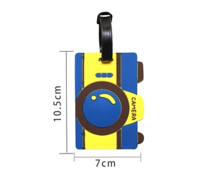 Detailed view of blue camera shaped PVC luggage tag showing 10.5cm by 7cm dimensions