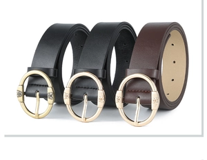 Detailed view of women's fashion leather belts in black and brown with metal buckles