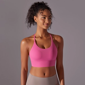 Detail of pink sports bra with thin straps and high-stretch fabric for yoga fitness