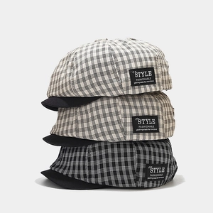 Retro plaid newsboy cap with black brim and side label patch for women and men