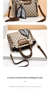 Macro shot of brown checkered tote with luxury silk scarf and gold metal hardware detail
