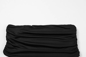 Detail of black pleated fabric with elastic texture and fine ruched mesh craftsmanship