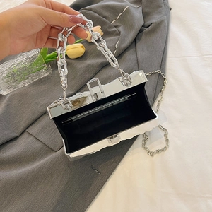 Silver metallic acrylic evening clutch bag with chain strap and elegant open compartment