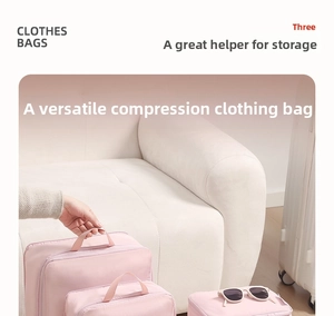 Pink compression travel organizers with reinforced handles and durable dual zippers