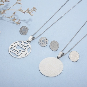 Titanium steel necklace and stud earrings set with Mama engraving on blue background