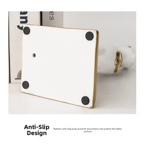 Detail of creative cat bookend base with non-slip pads and elegant gold coating trim