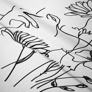 Close-up of minimalist black line art floral pattern on high-quality white fabric texture
