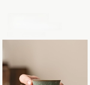 Macro detail of Ru kiln tea cup with ice crackle glaze and rust-colored rim finish