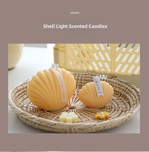 Macro shot of shell-shaped scented candles in cream yellow inside a rustic woven basket