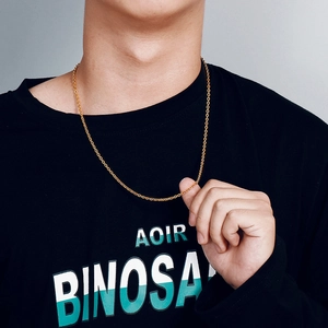 Detail of slim gold-plated stainless steel O-chain necklace on a female model