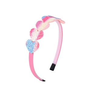 Detail of pink headband featuring gradient glitter heart ornaments for girls