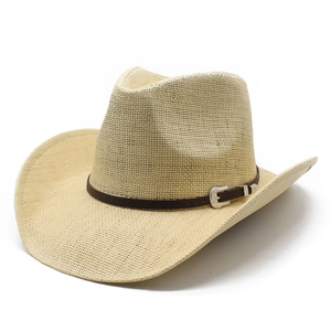 Vintage straw cowboy hat with brown leather band and engraved silver buckle on white background