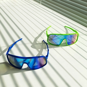 Detailed view of UV400 and CE certification marks on neon sports sunglasses lenses