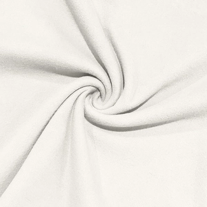 Macro shot of white velvet fabric showing soft fleece density and high-quality texture