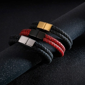 Detail of woven leather bracelets with magnetic clasps on a display stand