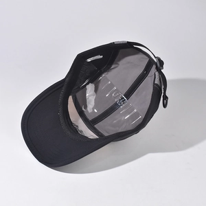 Detailed interior of the baseball cap showing gray lining, black sweatband and adjustable strap