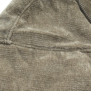 Detail shot of thick corduroy fabric texture and stitching on a warm winter hat