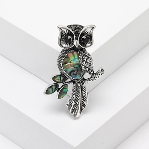 Vintage owl brooch with iridescent abalone shell inlay on silver metal tree branch