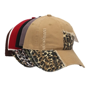 Distressed cotton baseball cap with leopard print patches and vintage ripped details