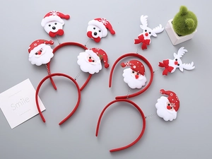 Detail of Christmas headband set with Santa, snowman and reindeer on spring wire