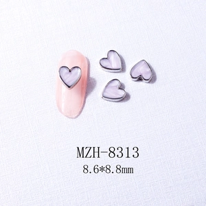Detail of 8.6x8.8mm heart nail charms with lavender marble texture and silver metal edges