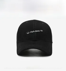 Close-up of black baseball cap featuring 3D embroidered NYCA lettering and fine stitching