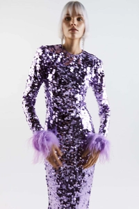 Close-up of sparkling purple sequins and plush feather cuffs on a long sleeve dress