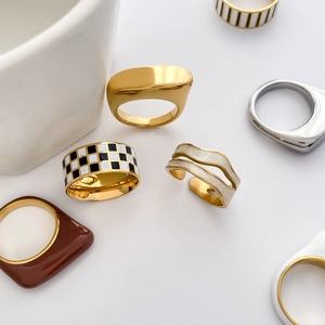 Chic collection of geometric enamel checkerboard rings and resin bands in gold and silver
