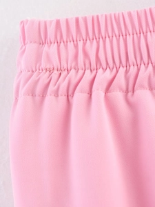 Detail of pink elastic waistband with premium twill fabric texture and fine stitching
