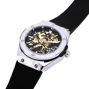 Macro detail of the silver octagonal brushed metal bezel with visible inner gold gears