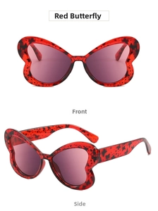 Detail view of red butterfly sunglasses with tortoiseshell pattern and purple lenses