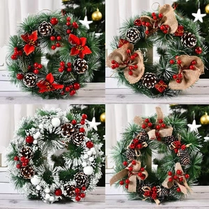 Four festive Christmas wreaths with pine needles, red berries, and white flocked snow