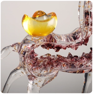 Macro detail of Nordic resin horse statue with gold foil inside and purple crystal base