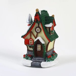 Lighted Christmas cottage resin miniature with snow-capped roof and festive red bow