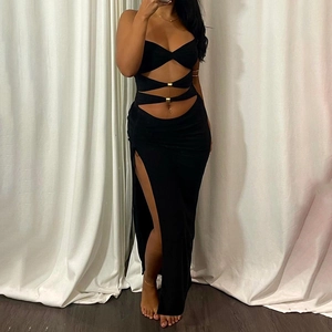 Black cutout maxi dress with metal buckles and side slit for a stylish vacation look