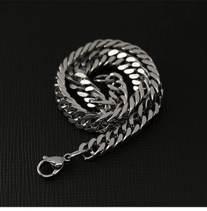Detailed view of silver titanium Cuban link chain bracelet with a sturdy lobster clasp