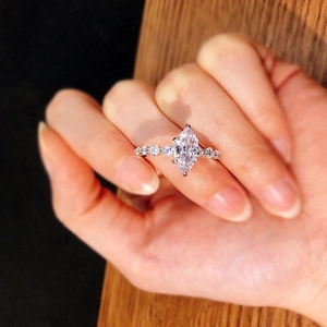 S925 sterling silver marquise cut zircon ring worn on finger with sparkling accent stones
