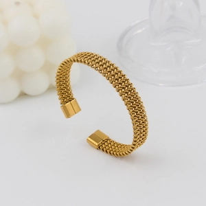 18K gold plated mesh twisted bangle in a 45-degree angle minimalist industrial style