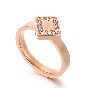 Rose gold stainless steel ring with flat square top and sparkling rhinestone border