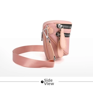 Side view of pink nylon crossbody bag showing double zipper layers and silver hardware