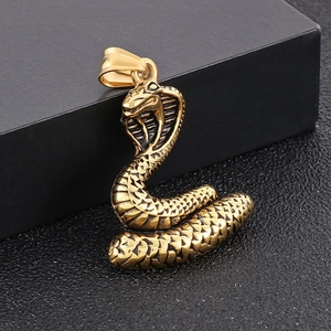Detailed macro view of a golden cobra snake pendant with realistic scales and textures